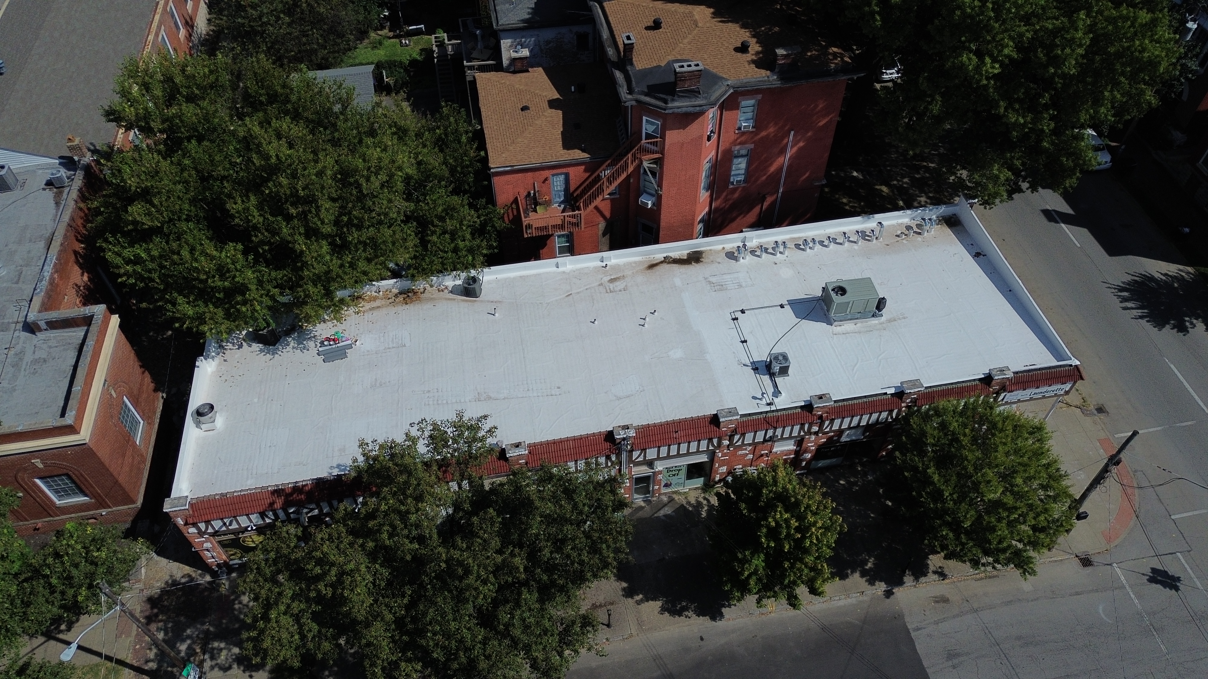 Aerial view of the completed 60-mil TPO roof restoration at Aunt Bee’s Laundry in downtown Louisville, Kentucky.