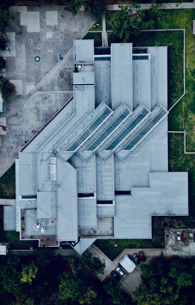 Aerial view of a modern commercial flat rooftop (placeholder stock photo)